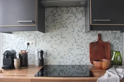 a kitchen with a sink and a counter top at Sunny Apartment - Zuid Retreat 1BR Apartment near Scheldt River in Antwerp