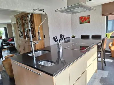 a kitchen with a sink and a counter top at Kapstertje in Grimbergen