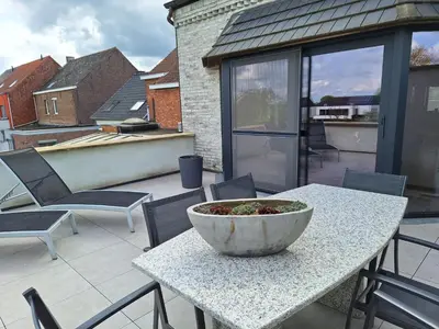 a bowl sitting on a table on a patio at Kapstertje in Grimbergen