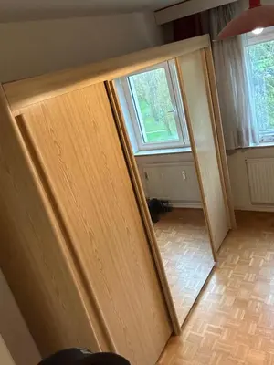 an open door in a room with a mirror at Résidence Europe in Brussels
