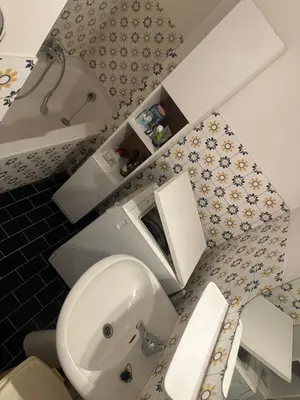 a bathroom with a toilet and a sink and a tub at Résidence Europe in Brussels