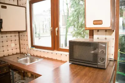 a microwave sitting on a counter in a kitchen at Archimede Guest House in Brussels