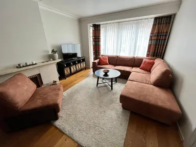 a living room with a couch and a table at Spacious 2 Bedroom App in the Center with Balcony in Ghent