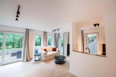a living room with a couch and a table at K-suites in Brussels