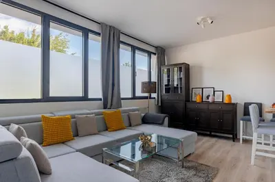 a living room with a couch and a table at Brussels EU Design Residence in Brussels