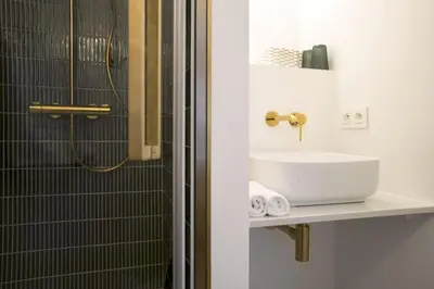 a bathroom with a sink and a shower at WoW in Brussels