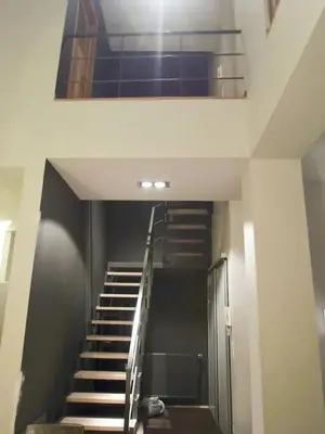 a staircase in a building with a stair case at Spacious apartment in Brussels, large private garden in Brussels