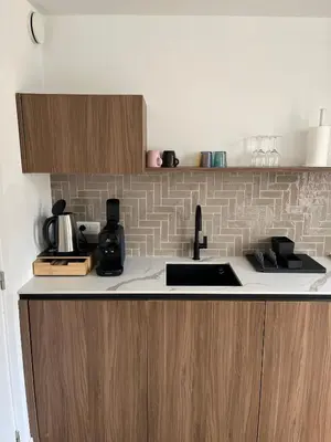 a kitchen with a sink and a counter top at Business Accommodation 'Natural Living' Nomad in Geel