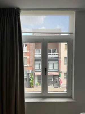 a window with a view of a building at Business Accommodation 'Natural Living' Nomad in Geel