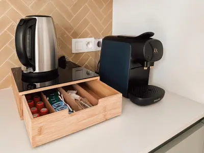 a coffeemaker and a coffee maker on a counter at Business Accommodation 'Scandinavian Living' Nomad in Geel