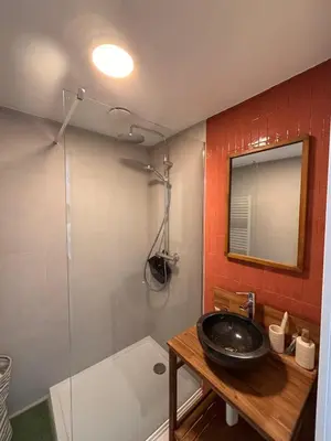 a bathroom with a sink and a tub and a mirror at Business Accommodation 'Flow Living' Nomad in Geel