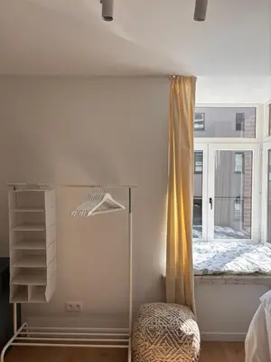 a bedroom with a bed and a window at Business Accommodation 'Flow Living' Nomad in Geel