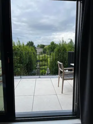 a view from a window of a patio with a chair at Business Accommodation 'Urban Living' Intimate in Geel