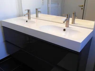 a bathroom with two sinks and a large mirror at VILLA EXPO in Brussels