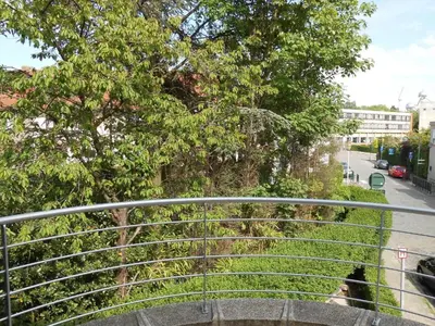 a metal bridge with trees on a street at VILLA EXPO in Brussels