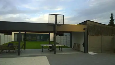 a building with a basketball hoop on top of it at Molenbaan28 in Merchtem