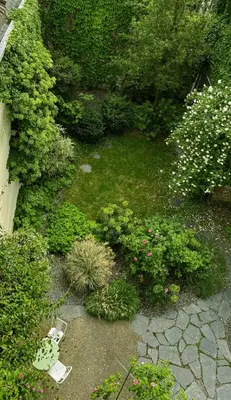 an aerial view of a garden with flowers and plants at Atelier K - Art Guesthouse in Brussels in Brussels