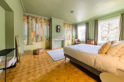 a bedroom with a large bed in a room at Atelier K - Art Guesthouse in Brussels in Brussels