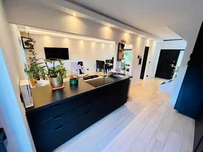 a living room with a desk in the middle at Town house with garden - 1 room with shared bathroom in Brussels