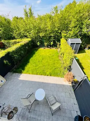 an overhead view of a patio with a table and chairs at Town house with garden - 1 room with shared bathroom in Brussels