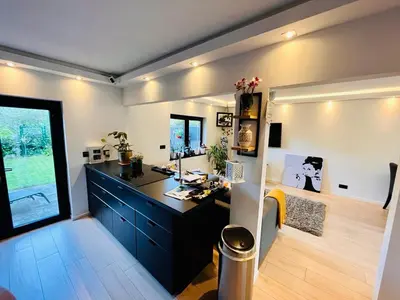 a office with a desk and a window in a room at Town house with garden - 1 room with shared bathroom in Brussels
