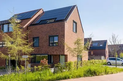a house with solar panels on the side of it at Lichtrijke woning vlakbij Leuven in Herent