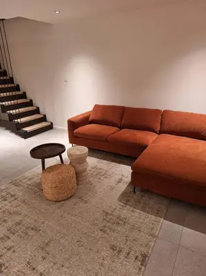 a living room with a couch and a table at Zeer unieke vakantiewoning in Herentals