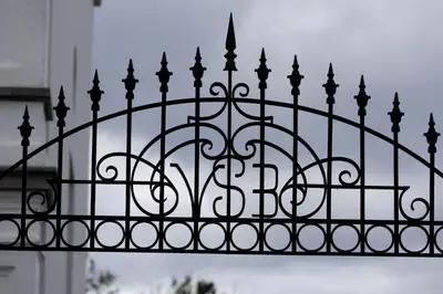 a black metal fence with the letter b on it at Zeer unieke vakantiewoning in Herentals