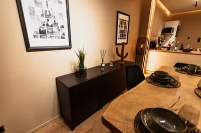 a room with two beds and a cabinet at Golden Dove Luxury Apartment in Brussels