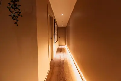 a hallway with a light strip on the wall at Golden Dove Luxury Apartment in Brussels