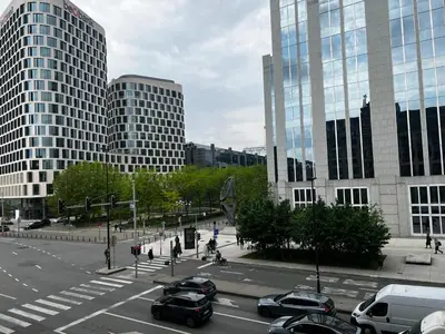 a view of a city street with cars and buildings at Jardin Botanique in Brussels