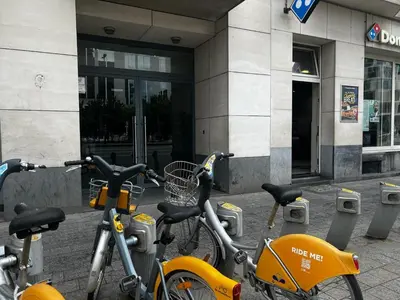 a group of bikes parked in front of a building at Jardin Botanique in Brussels