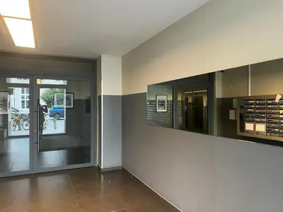 a hallway with glass doors in a building at Jardin Botanique in Brussels