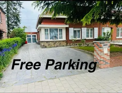 a free parking sign in front of a house at Cosy in Mechelen