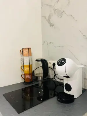 a kitchen counter with a coffee maker and a coffeemaker at Cosy in Mechelen