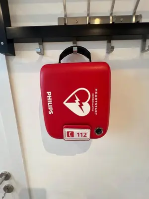 a red suitcase is hanging on a shelf at Cosy in Mechelen