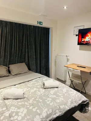 a bedroom with a bed with two towels on it at Cosy in Mechelen