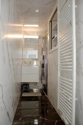 a bathroom with a white sink and a mirror at Chez Nadège in Affligem