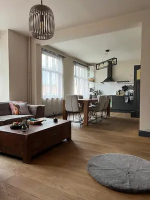 a living room with a couch and a table at Ces Home Centrum in Ghent