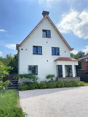 a white house with a gambrel roof at Villa Tibur - Near Boom & Rumst in Rumst