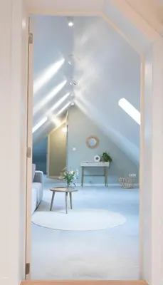 a living room with a white couch and a table at Cuypershof in Oosterzele