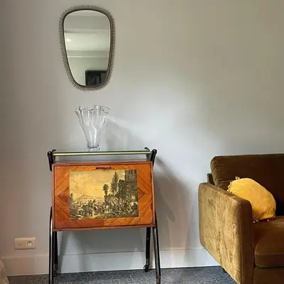 a table with a picture on it next to a couch at The Cottage in Merelbeke
