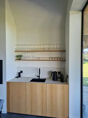 a kitchen with a sink and a counter at De Mispel in Groot Schaddeken Dries