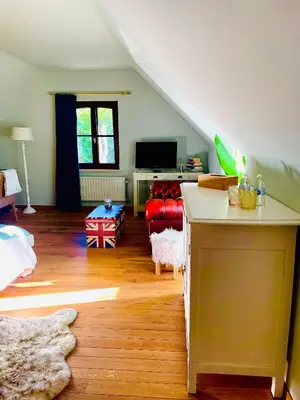 a living room with a couch and a table at Zenitude in Tremelo