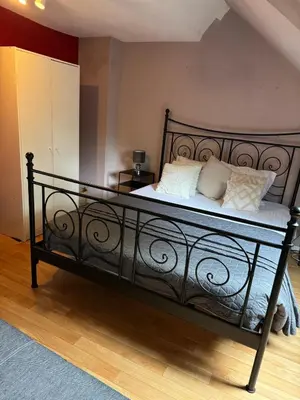 a black bed with pillows on it in a room at Nilvaevents in Duffel