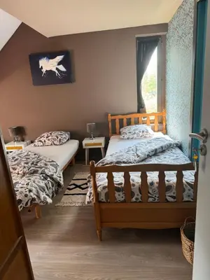 a bedroom with two beds and a window at Nilvaevents in Duffel