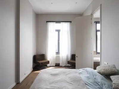 a bedroom with a bed and a mirror at CE RESIDENCE 2 in Ghent