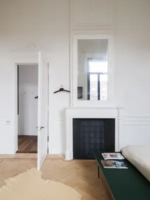a living room with a fireplace and a green coffee table at CE RESIDENCE 2 in Ghent