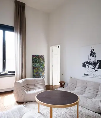 a living room with a couch and a coffee table at CE RESIDENCE 2 in Ghent