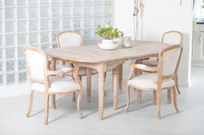 a wooden table with four chairs and a table and a table and chairsktop at Country Villa - Tervuren in Tervuren